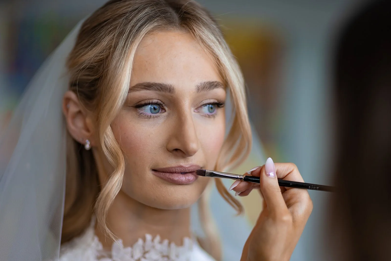 bride has make up applied during prep at mercure manchester piccadilly