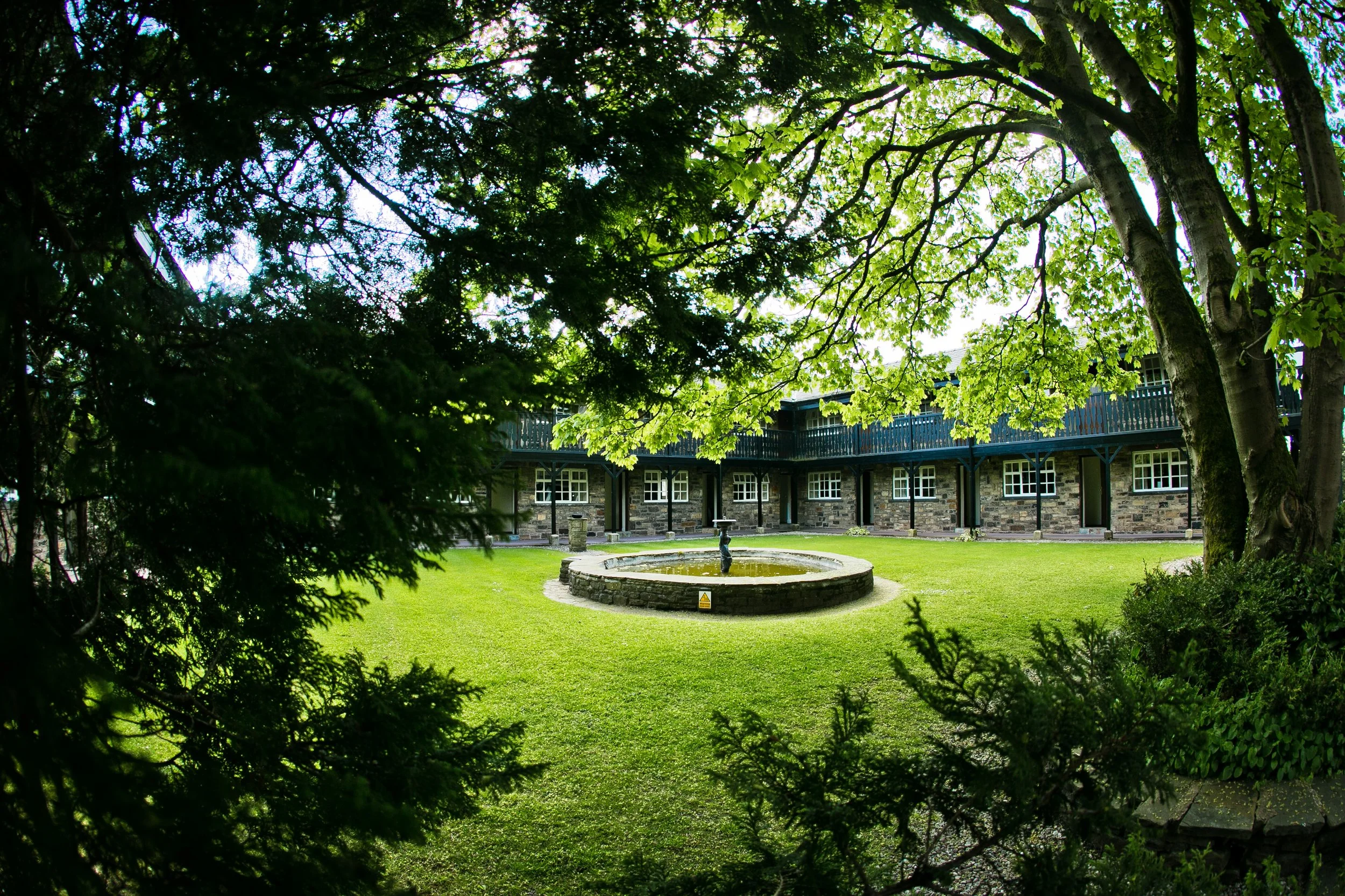 last drop village wedding venue exterior with fountain in courtyard