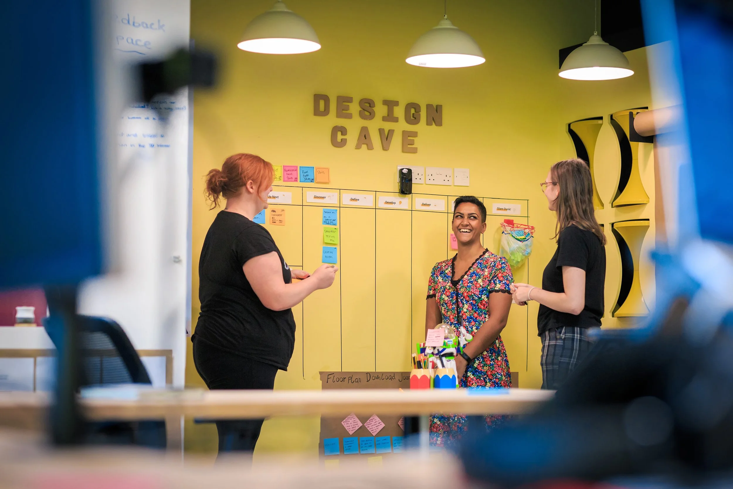 Employees collaborating in a creative workspace