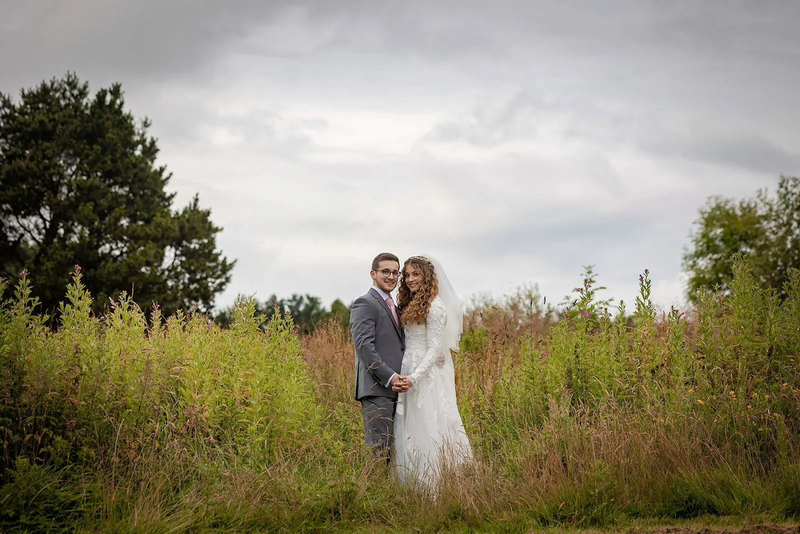 bride and groom newlywed couple portrait at last drop village wedding venue in bolton