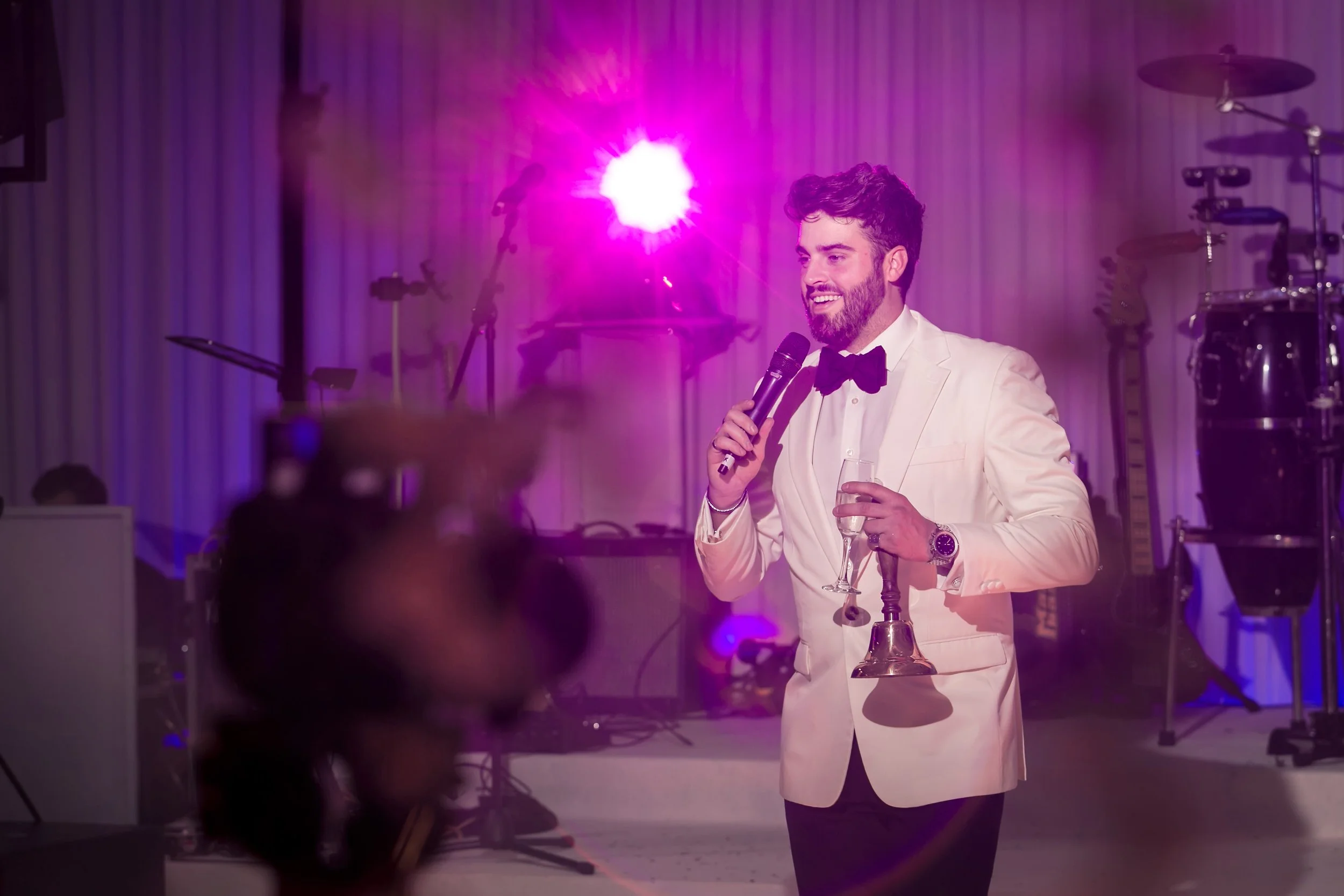 Singer in white tuxedo performing at Fairmont Cheshire - The Mere wedding
