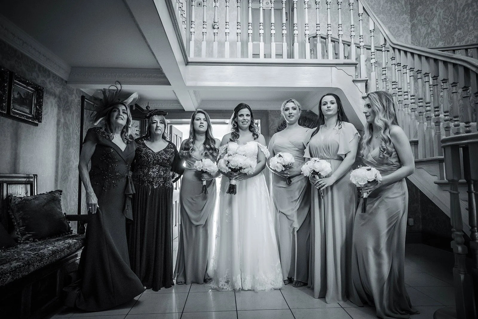 Merrydale Manor wedding bride bridesmaids staircase black and white – documentary wedding photographer Manchester