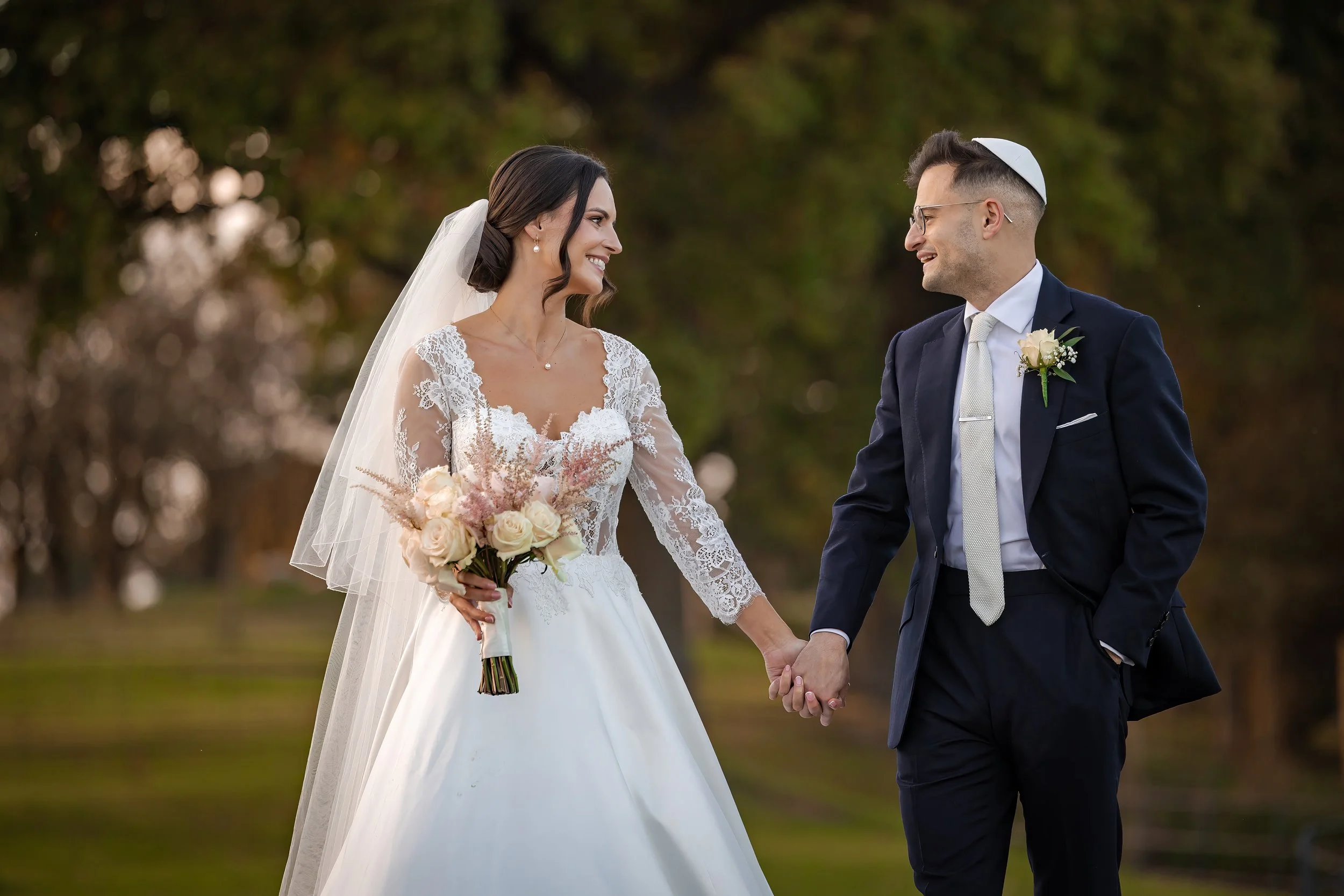 Merrydale Manor wedding couple holding hands smiling at ceremony – wedding photography Cheshire