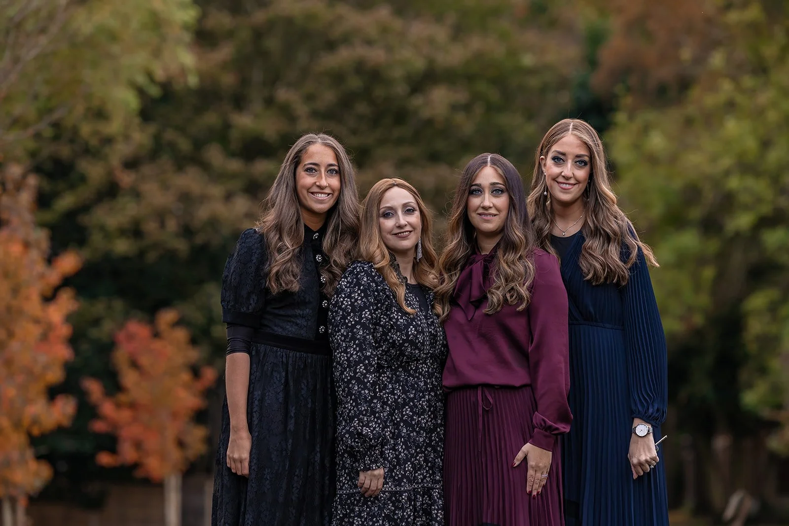 barmitzvah mum and sisters portrait in park in Manchester