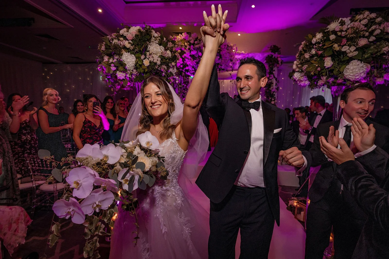 bride and groom leave wedding ceremony at mere golf resort in cheshire