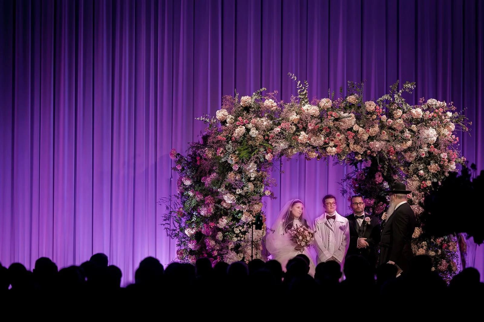 bride and groom exchange vows during wedding ceremony at manchester deansgate hotel