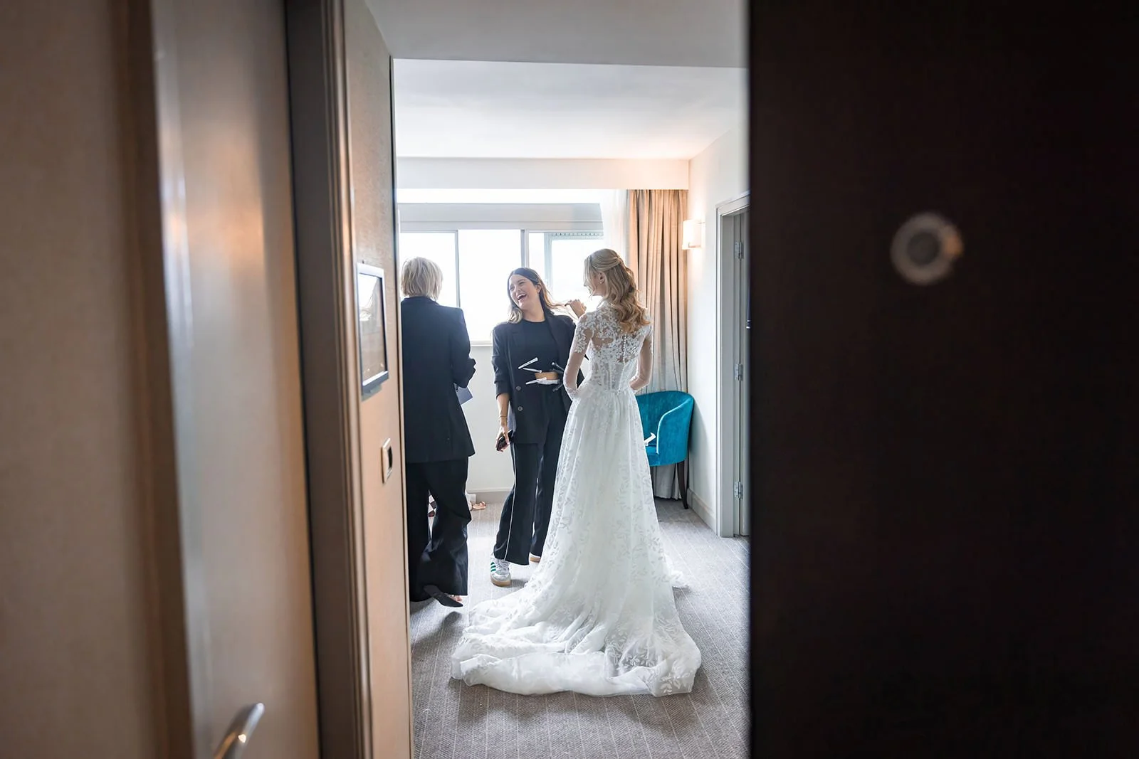 bride gets in dress during prep at mercure manchester piccadilly