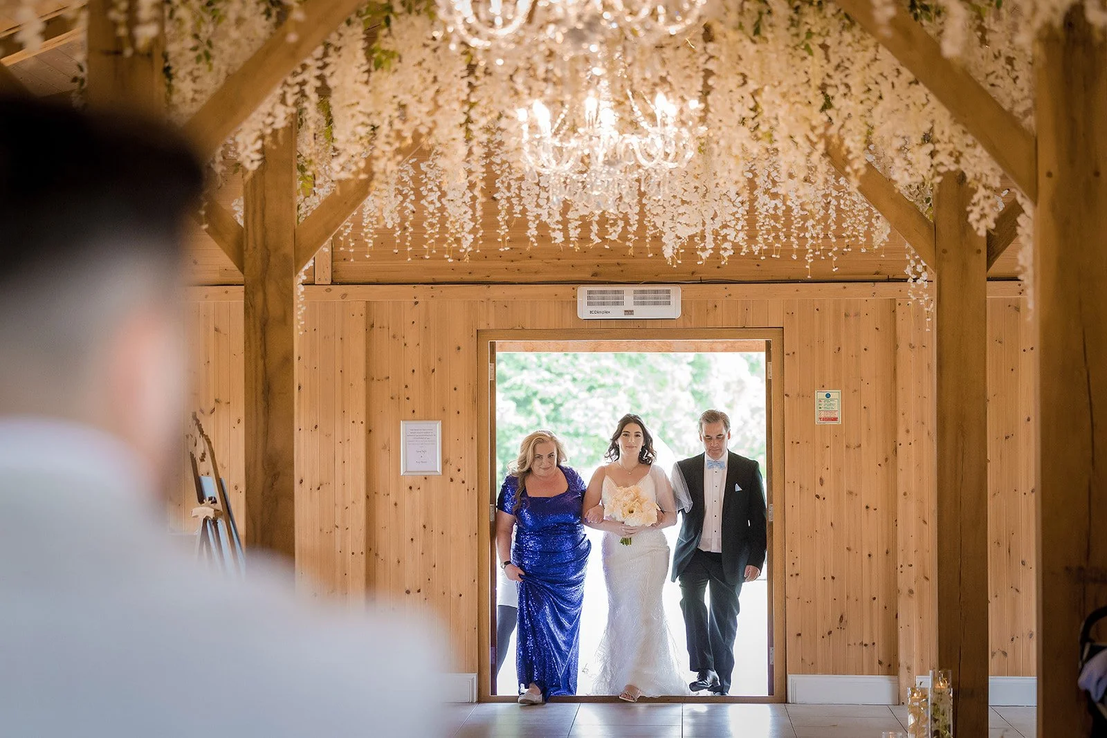 Merrydale Manor wedding bride entering chapel with parents – documentary wedding photography Manchester
