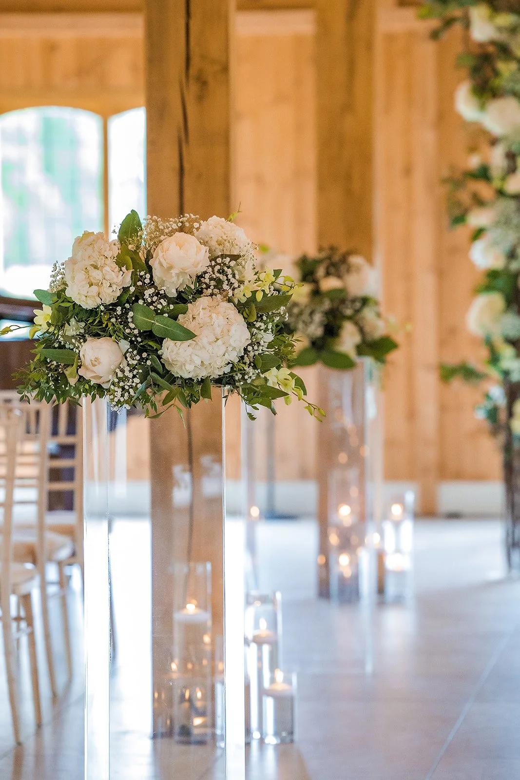 Merrydale Manor wedding tall floral centrepiece white flowers aisle – wedding photography Cheshire