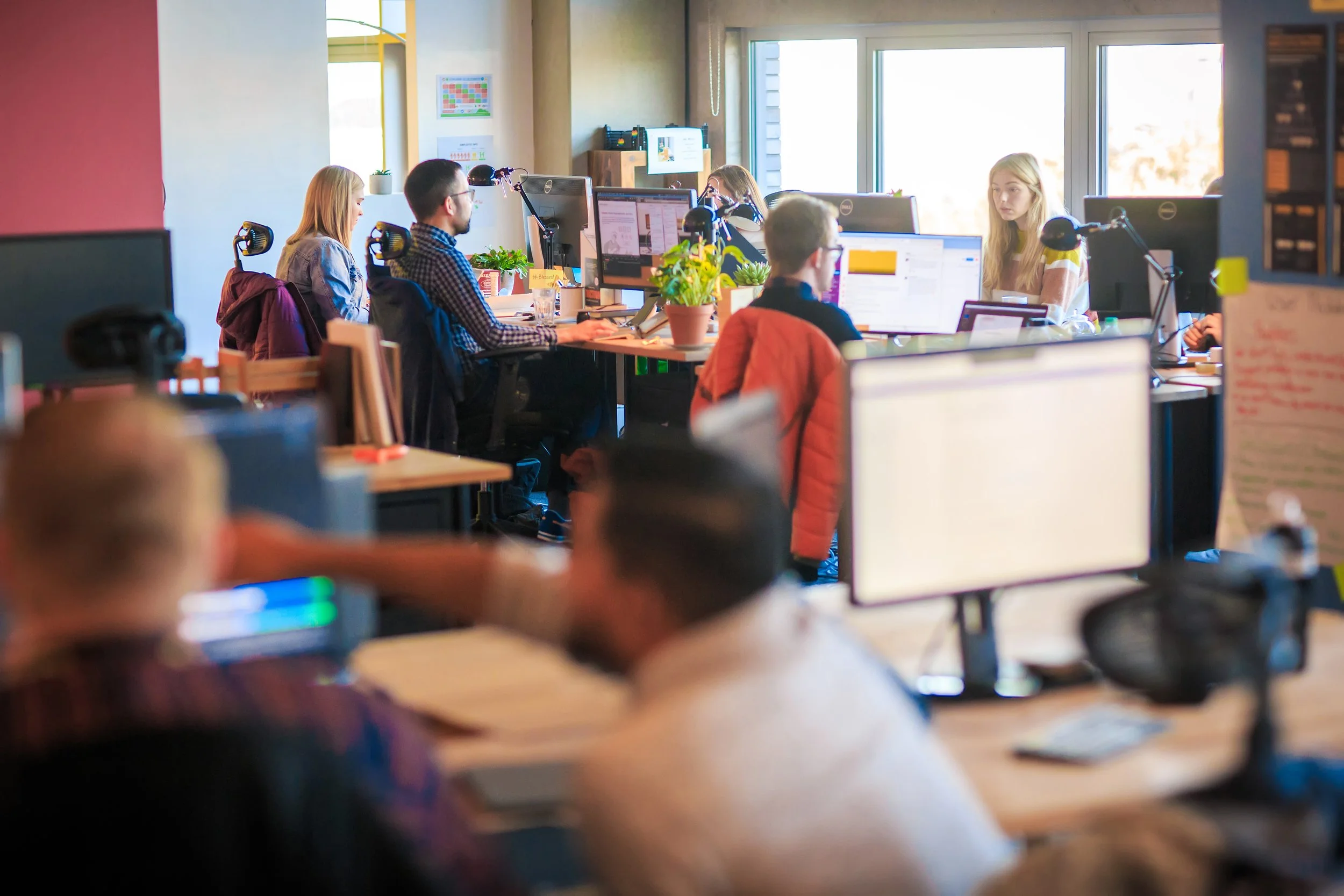 Staff working in an open-plan office environment