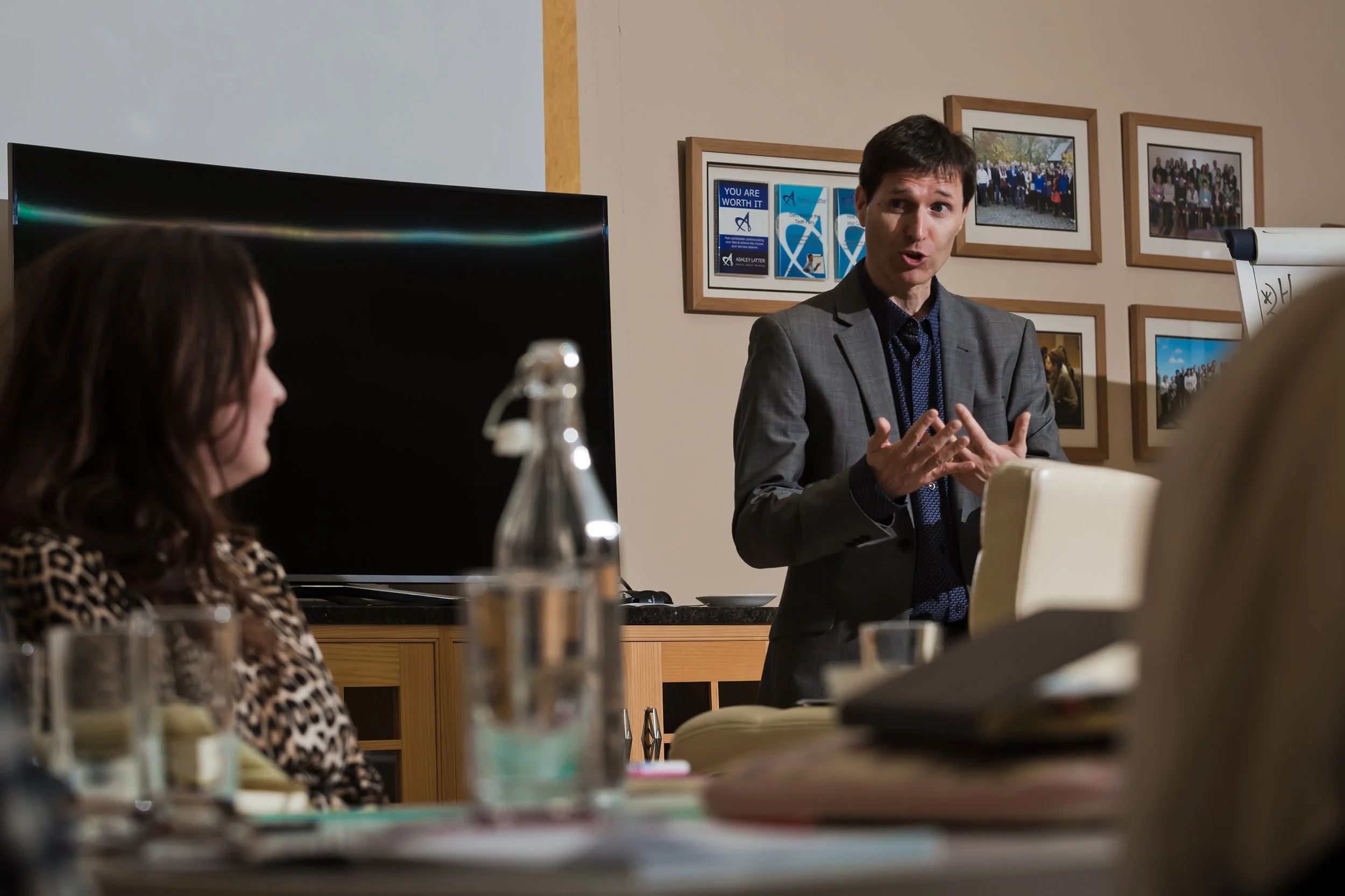 Workshop facilitator delivering a business training session