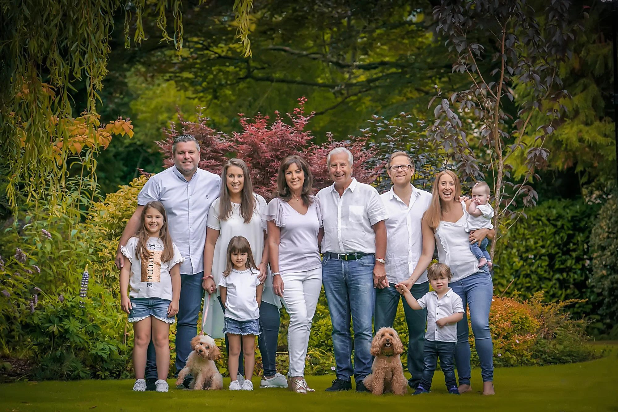 family portrait in garden with dogs