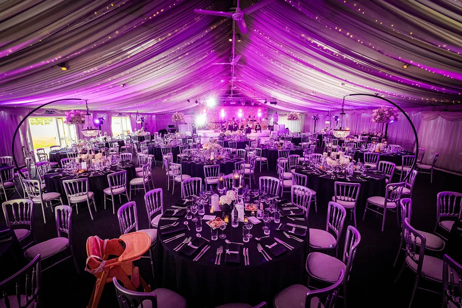 heaton house farm wedding reception dinner set up in steel barns