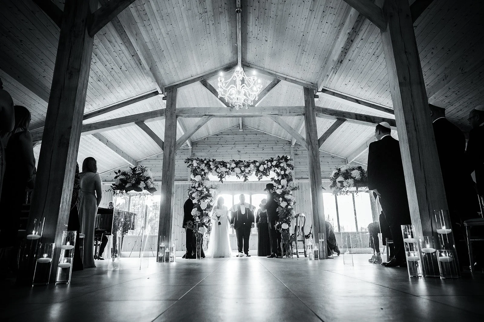 Merrydale Manor wedding ceremony black and white barn floral arch – documentary wedding photographer Manchester