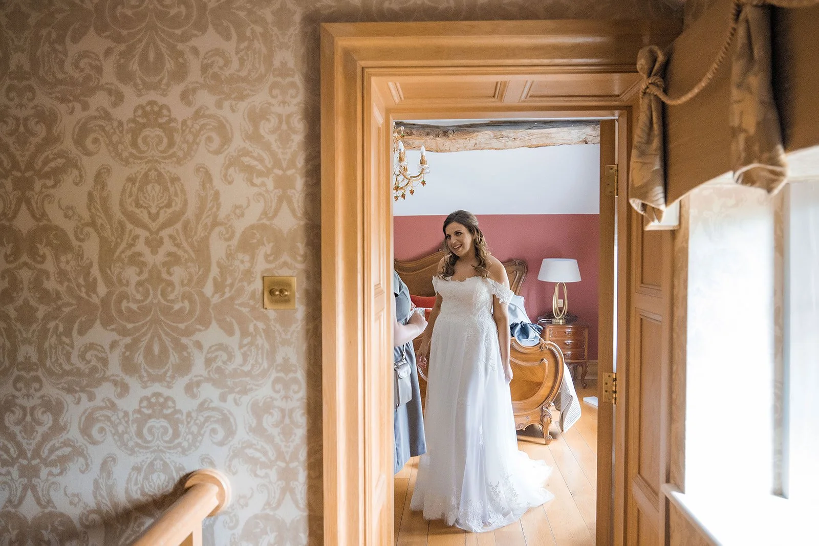 Merrydale Manor wedding bride getting ready through doorway – Manchester wedding photographer