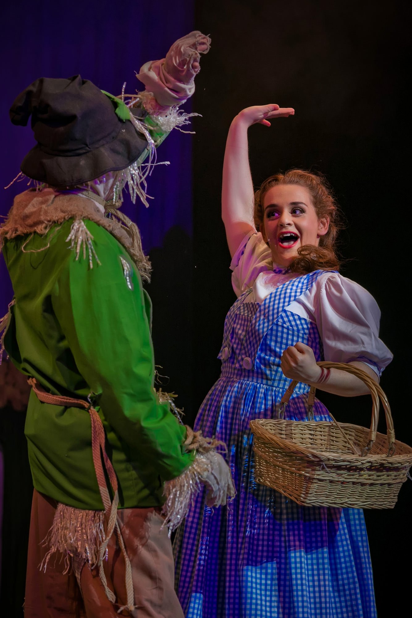 dorothy and scarecrow in wizard of oz production on stage theatre performance dramatic photography portrait with make-up and costume