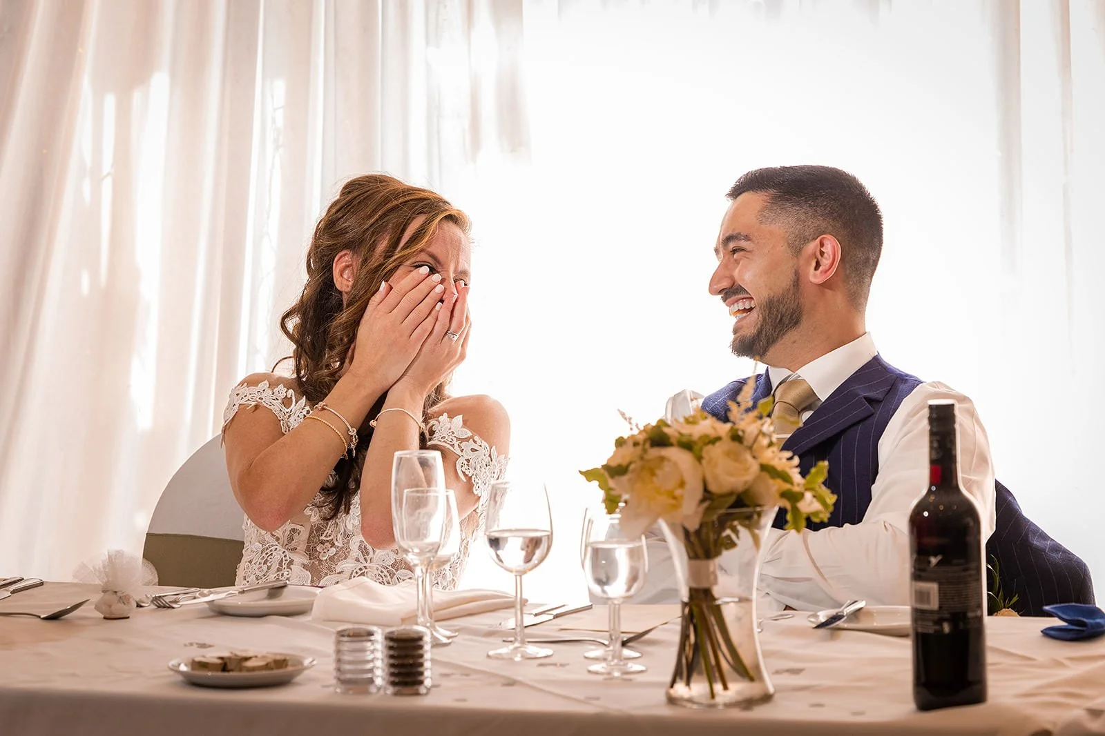 bride and groom react to wedding speech during reception at worsley marriott hotel