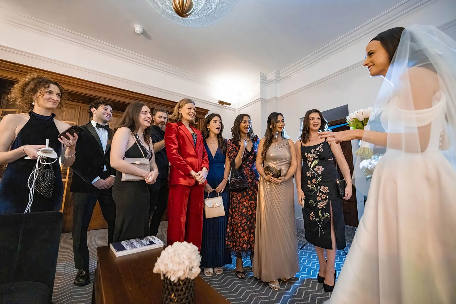bride first look with friends during bridal prep at kimpton clocktower manchester