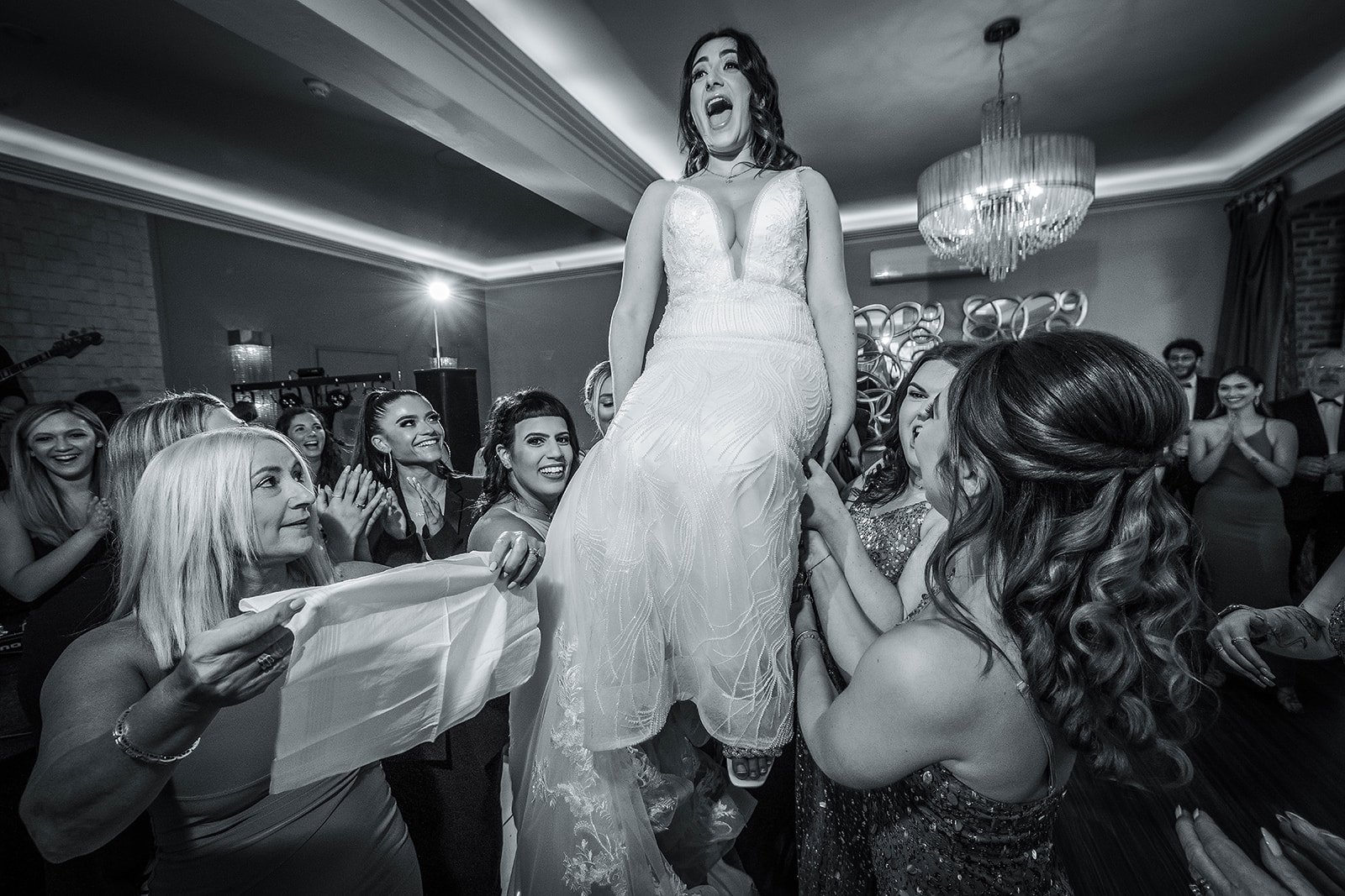 Merrydale Manor wedding bride lifted on chair reception dancing – documentary wedding photographer Manchester