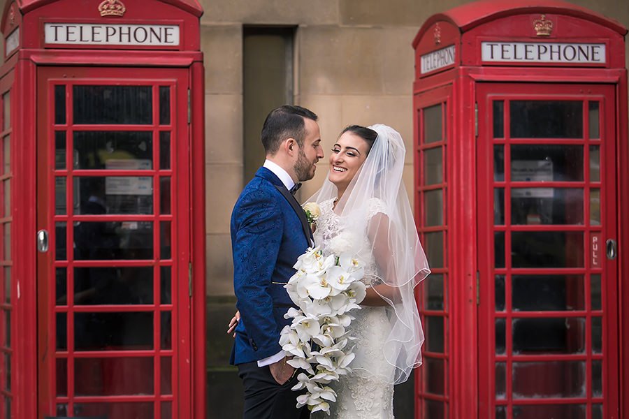 Manchester wedding photographer Jewish bride and groom newlywed couple portraits with red phone booths