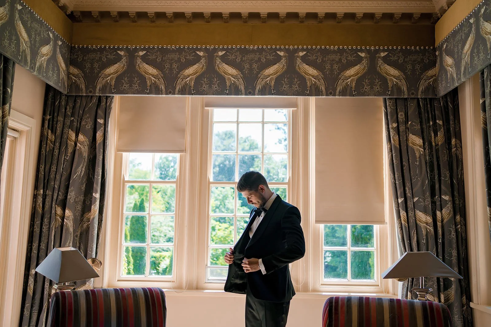 Groom prep at nunsmere hall wedding venue in cheshire