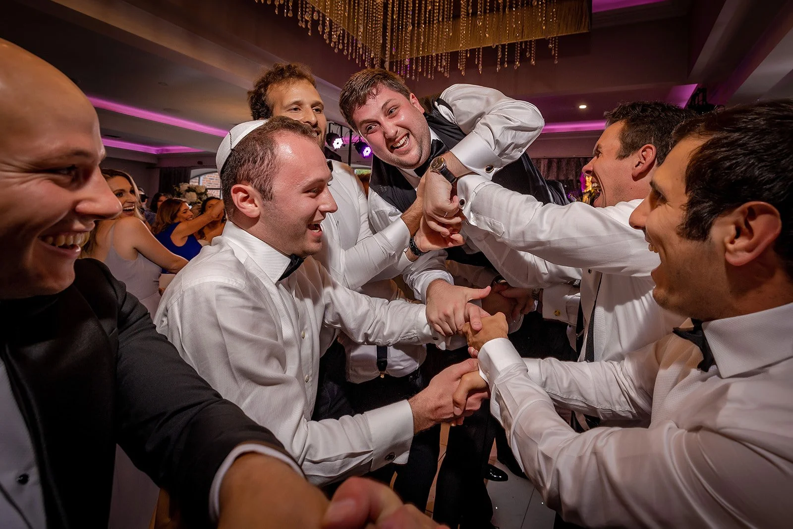 Merrydale Manor wedding groomsmen celebrating at reception – wedding photographer North West England