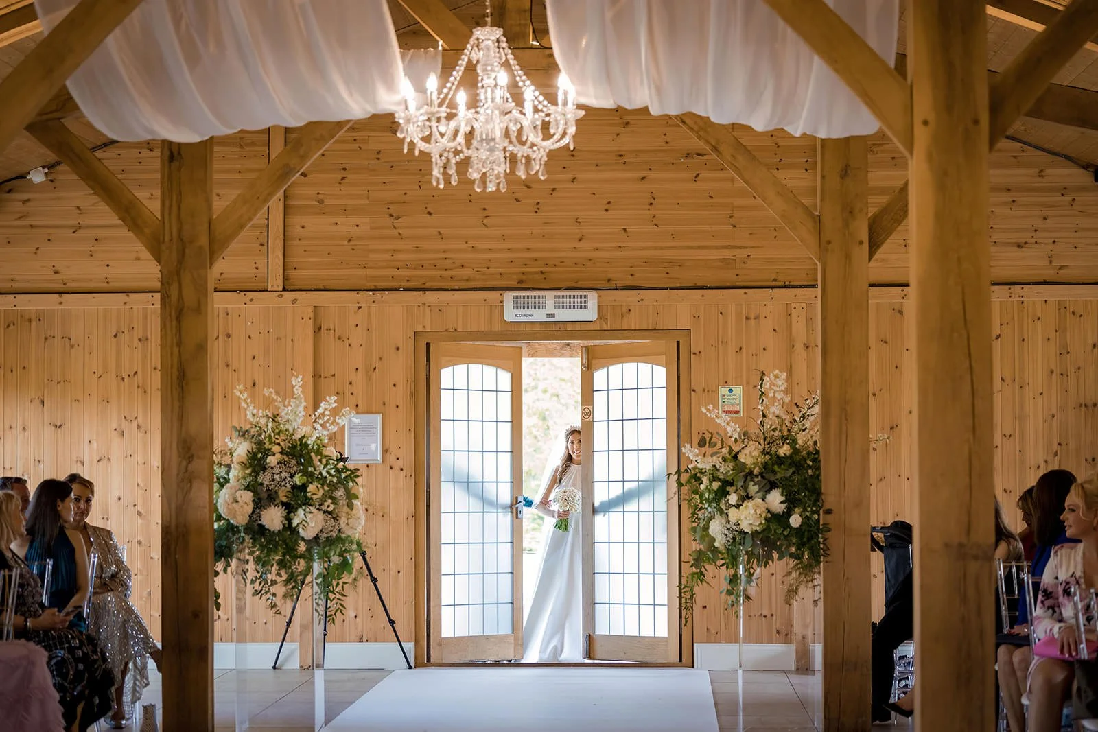 Merrydale Manor wedding bride entering ceremony through double doors – wedding photographer North West England