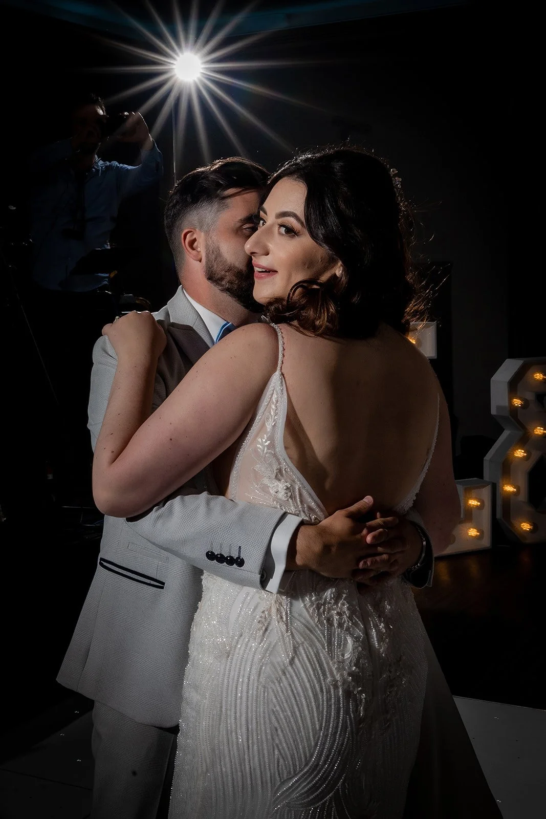 Merrydale Manor wedding couple dancing closely dark background – documentary wedding photographer Manchester