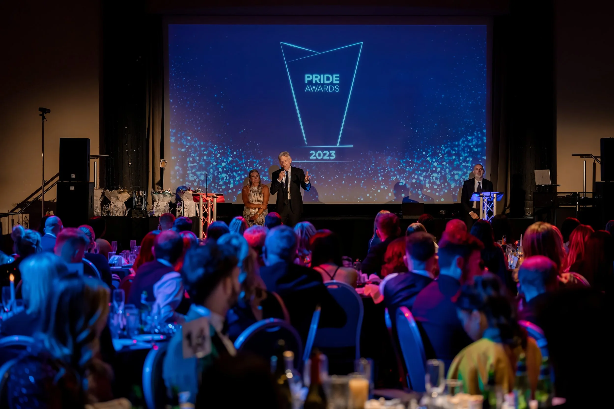 Awards presentation taking place at a corporate gala dinner