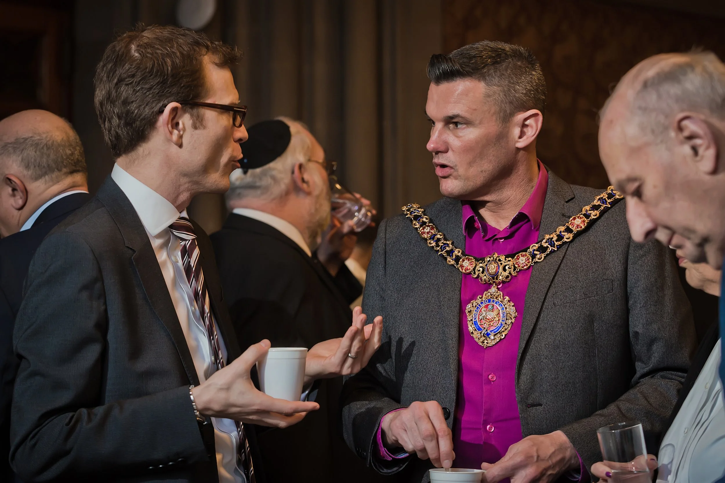 Civic leader networking with guests at a business event