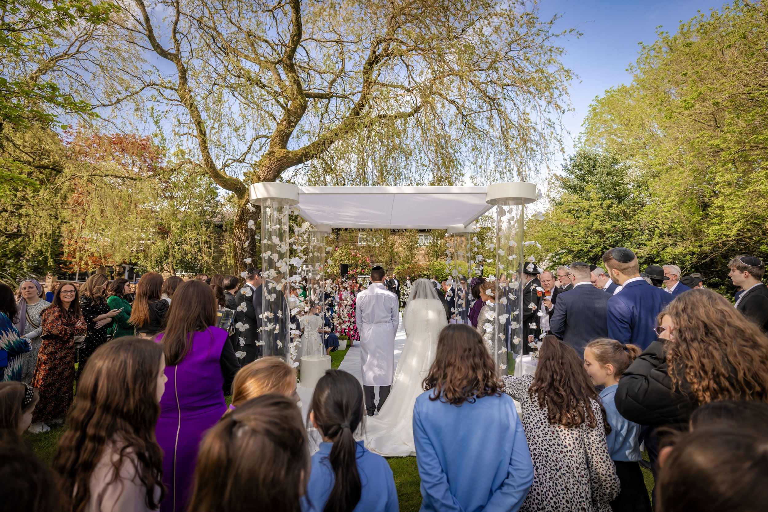 chosson groom and kallah bride under chuppah at charedi jewish wedding ceremony
