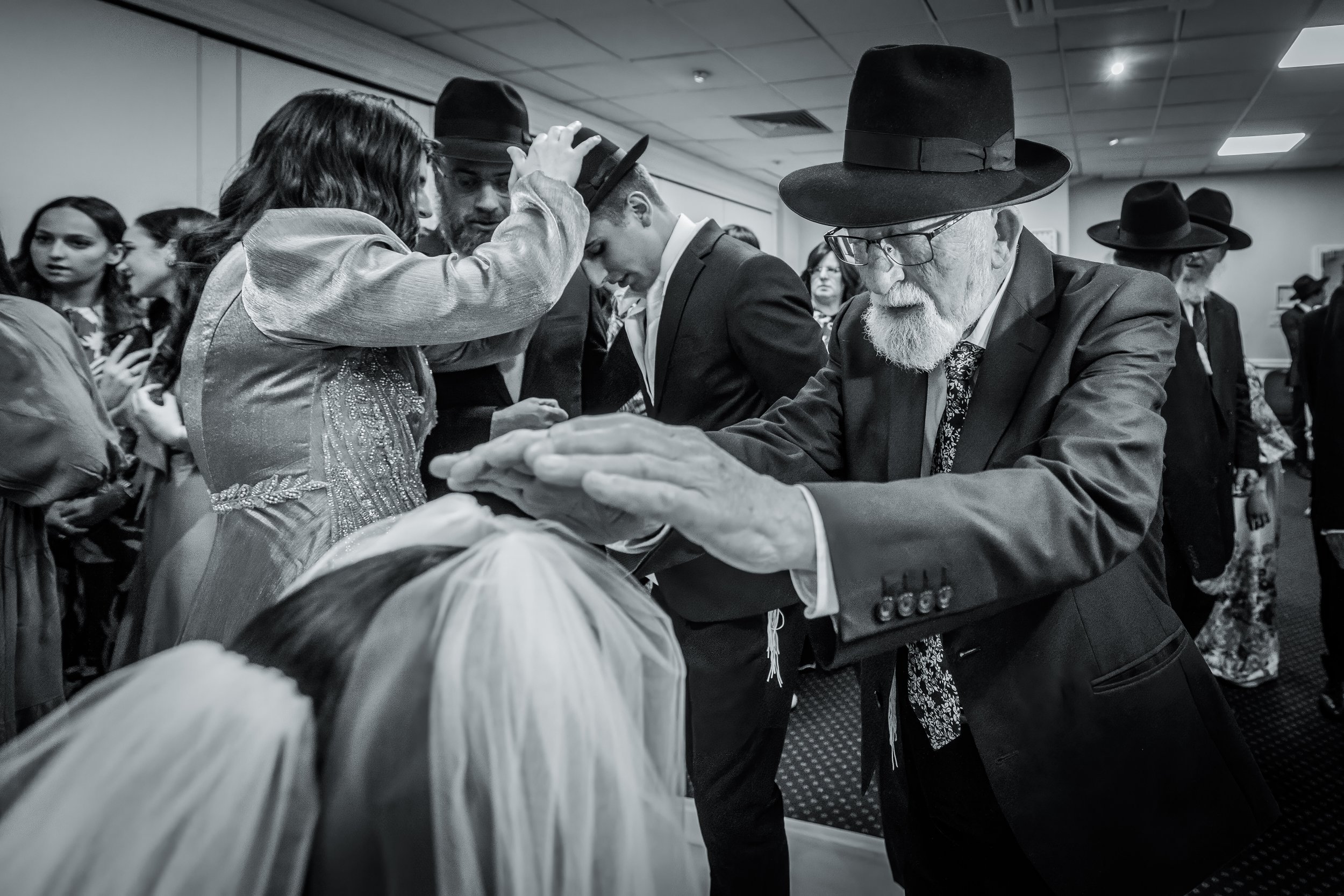kallah bride receives blessing during bedeken at charedi jewish wedding