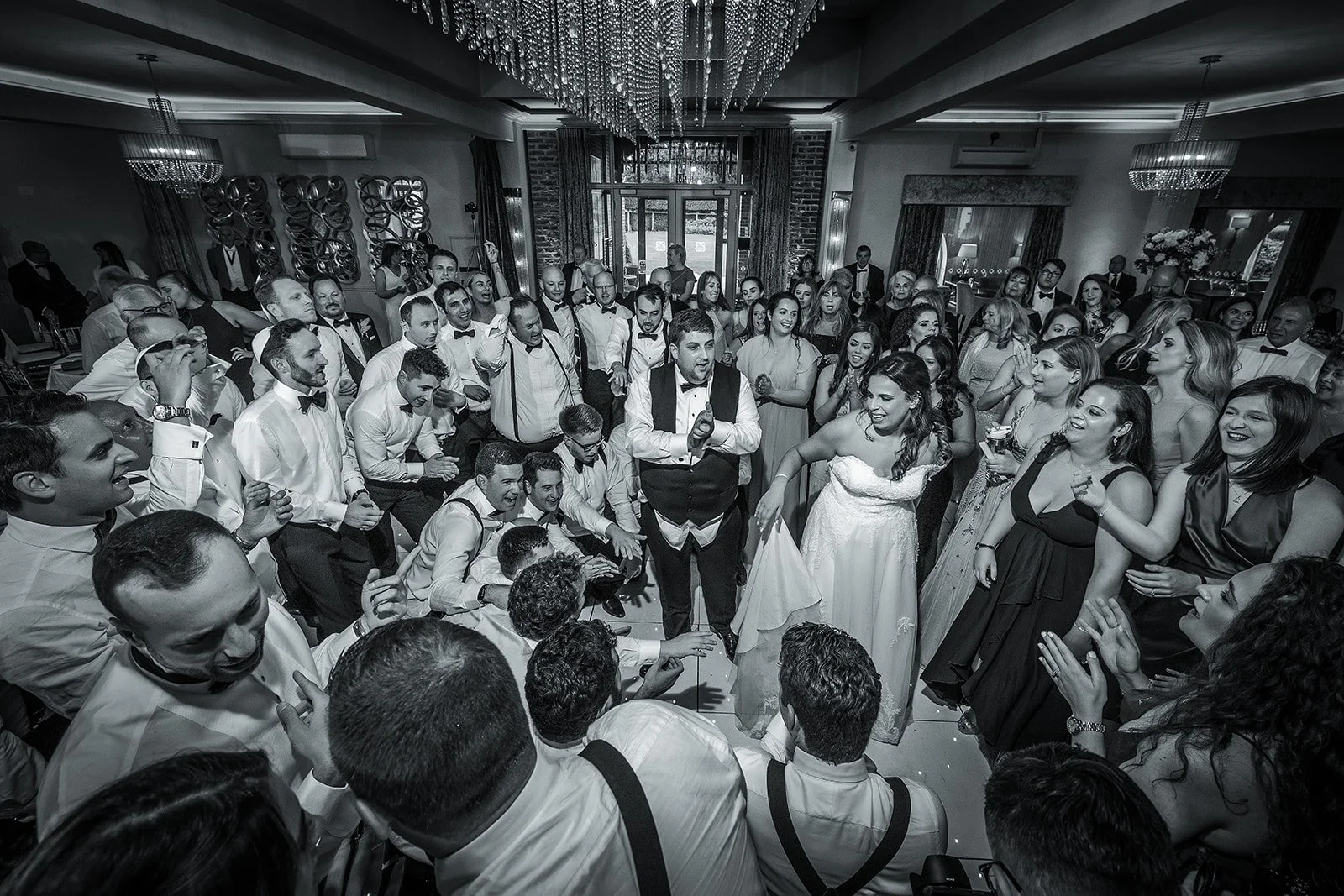 Merrydale Manor wedding reception black and white couple at center – documentary wedding photography Manchester