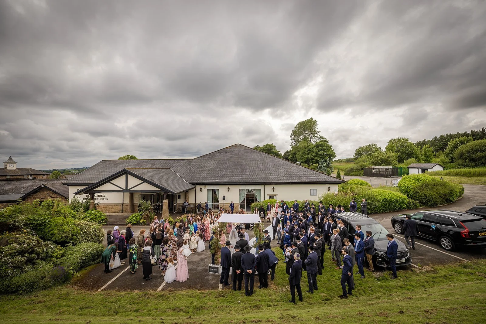 outdoor wedding ceremony at last drop village in bolton