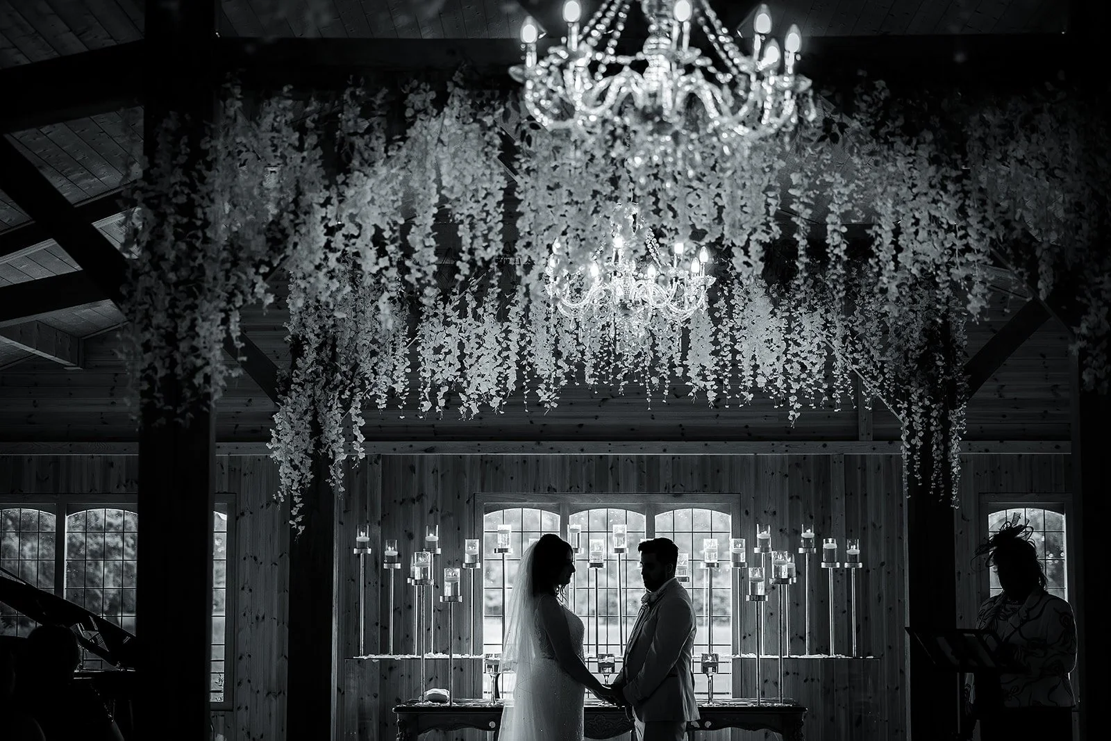 Merrydale Manor wedding silhouette couple under chandelier hanging flowers – Manchester wedding photographer