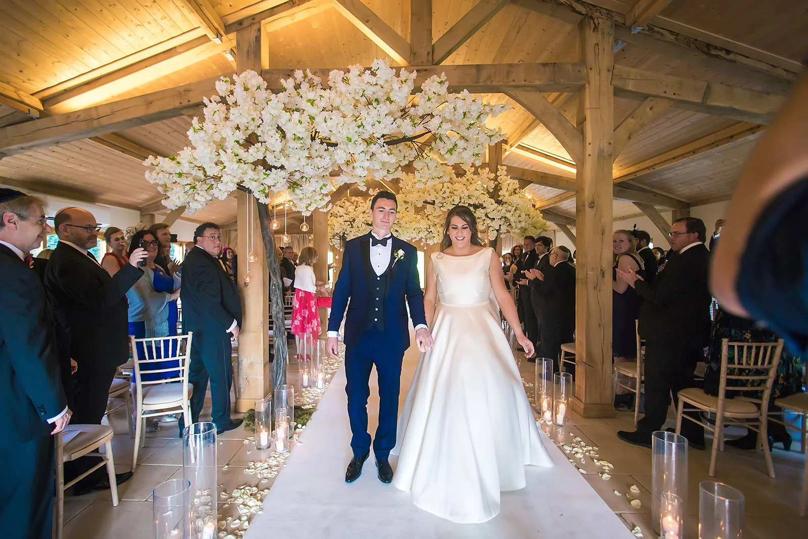 bride and groom leaving ceremony at colshaw hall in cheshire