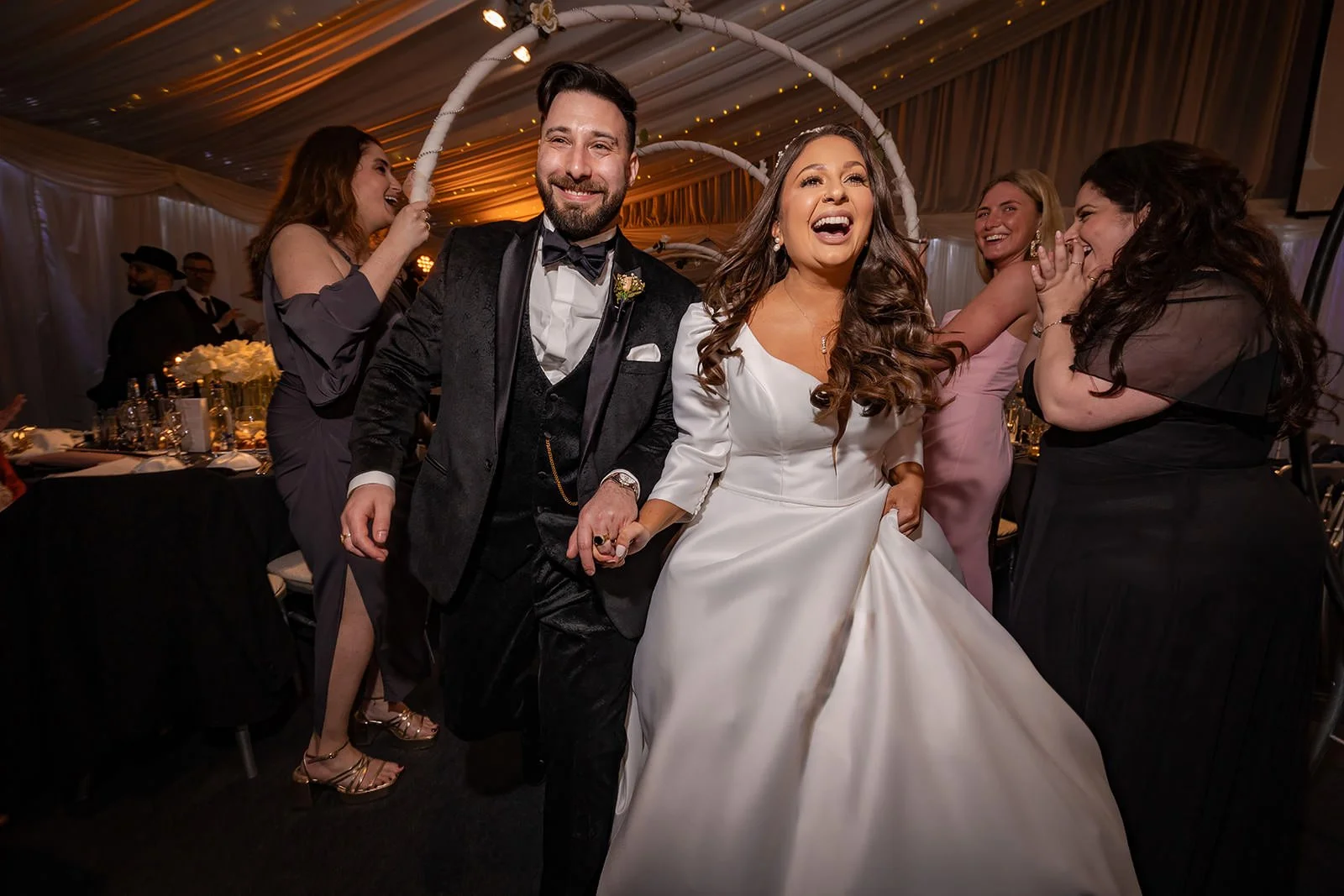 bride and groom make entrance onto wedding reception dance floor at heaton house farm