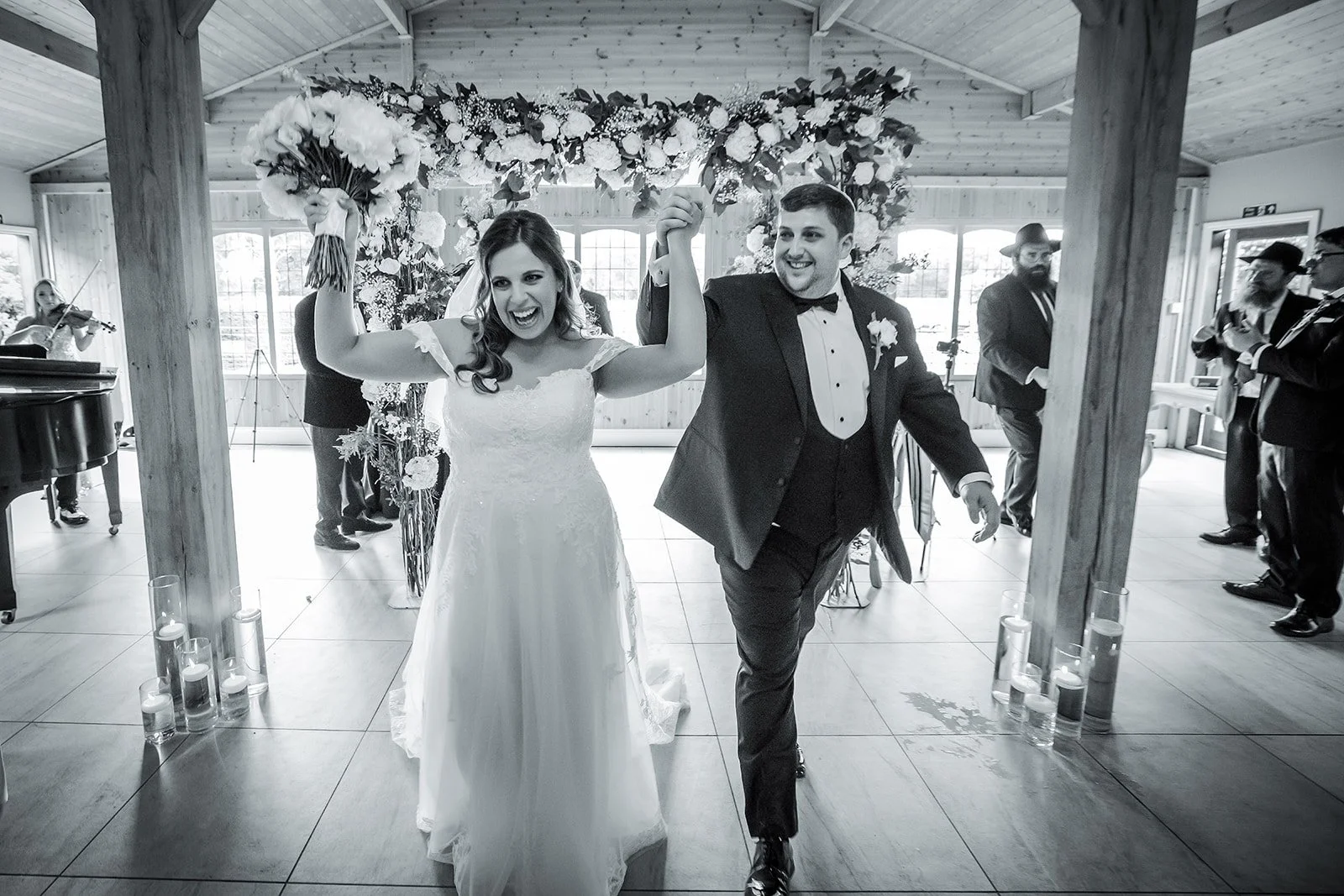 Merrydale Manor wedding couple holding hands smiling at reception – wedding photography North West