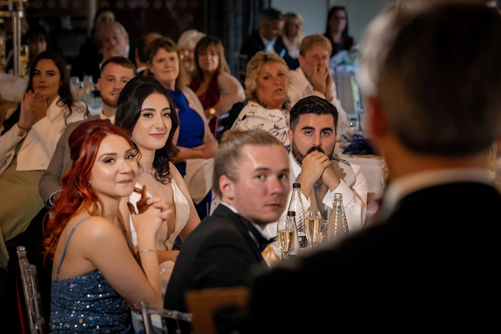 Merrydale Manor wedding guests at reception seated listening to speech – documentary wedding photography Manchester