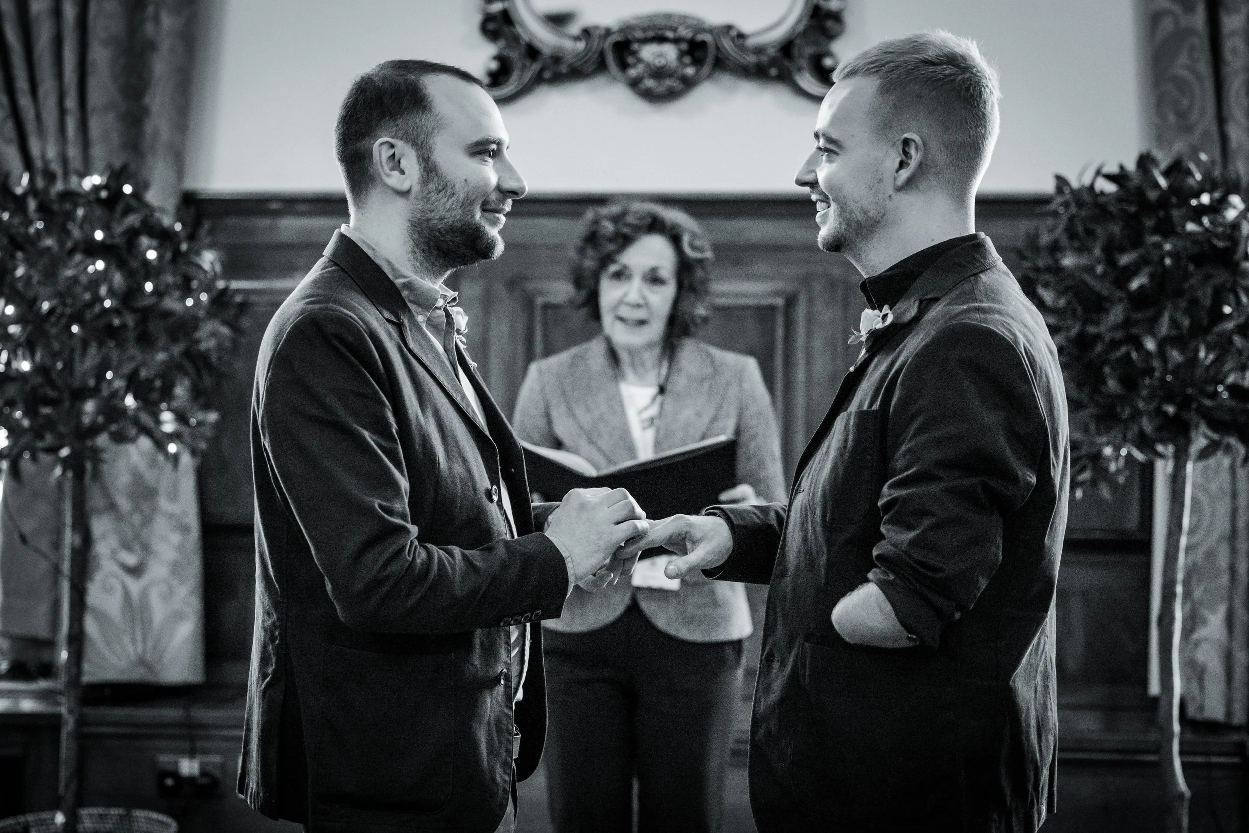 gay couple grooms exchange rings and vows in Manchester