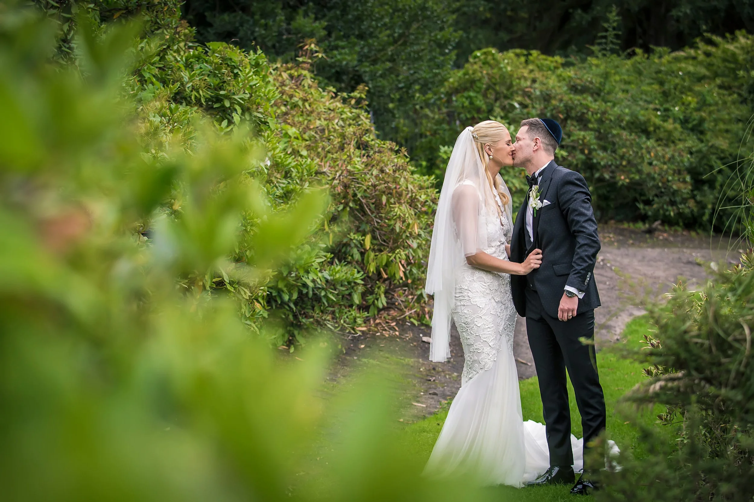 romantic bride and groom newlywed couple portrait at sefton park palm house in liverpool