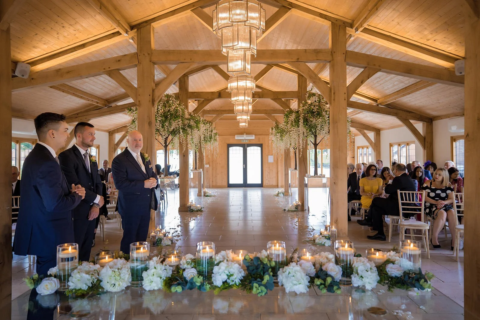 groom waits for bride during wedding ceremony at colshaw hall in cheshire