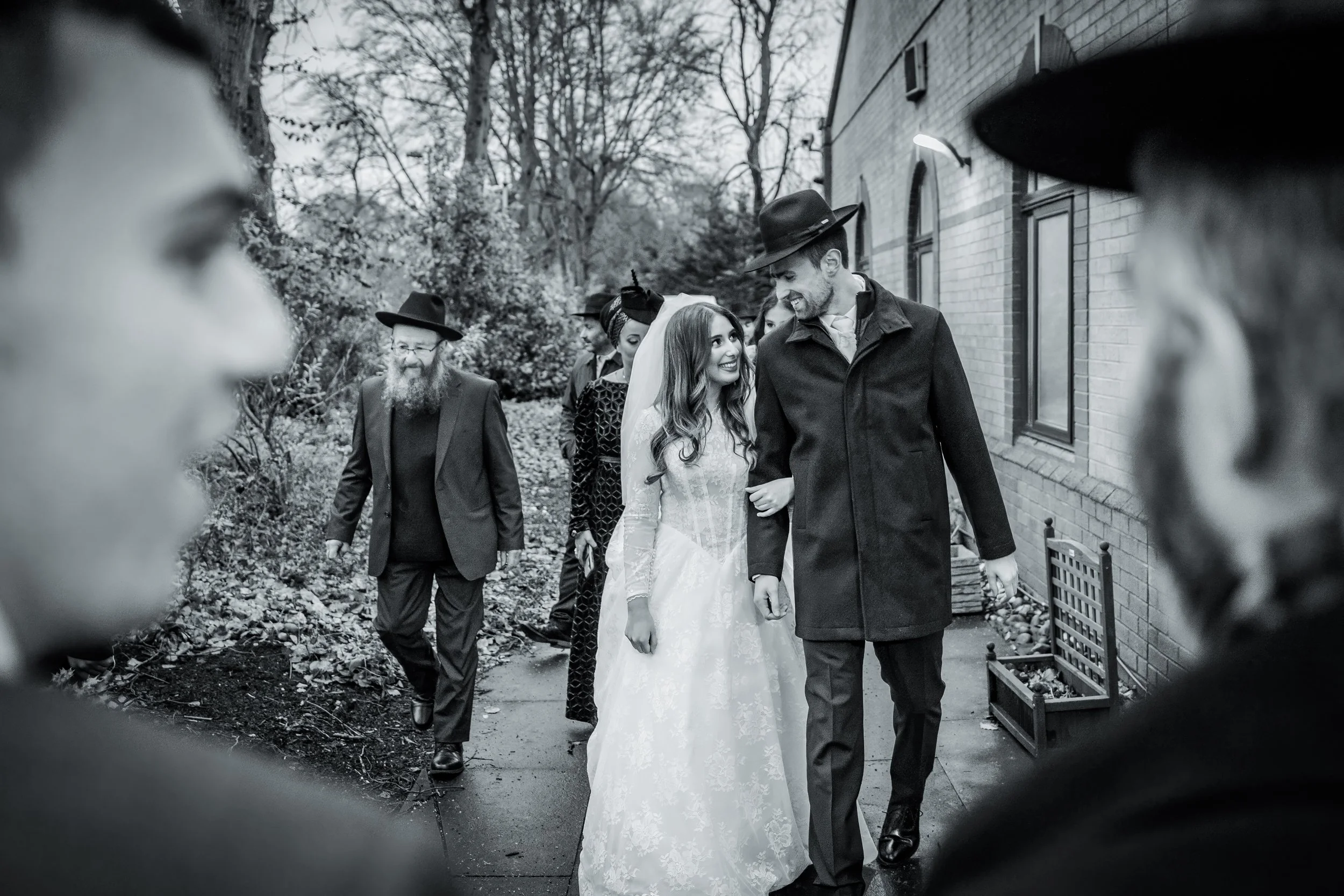 chosson groom and kallah bride leave chuppah at charedi jewish wedding ceremony