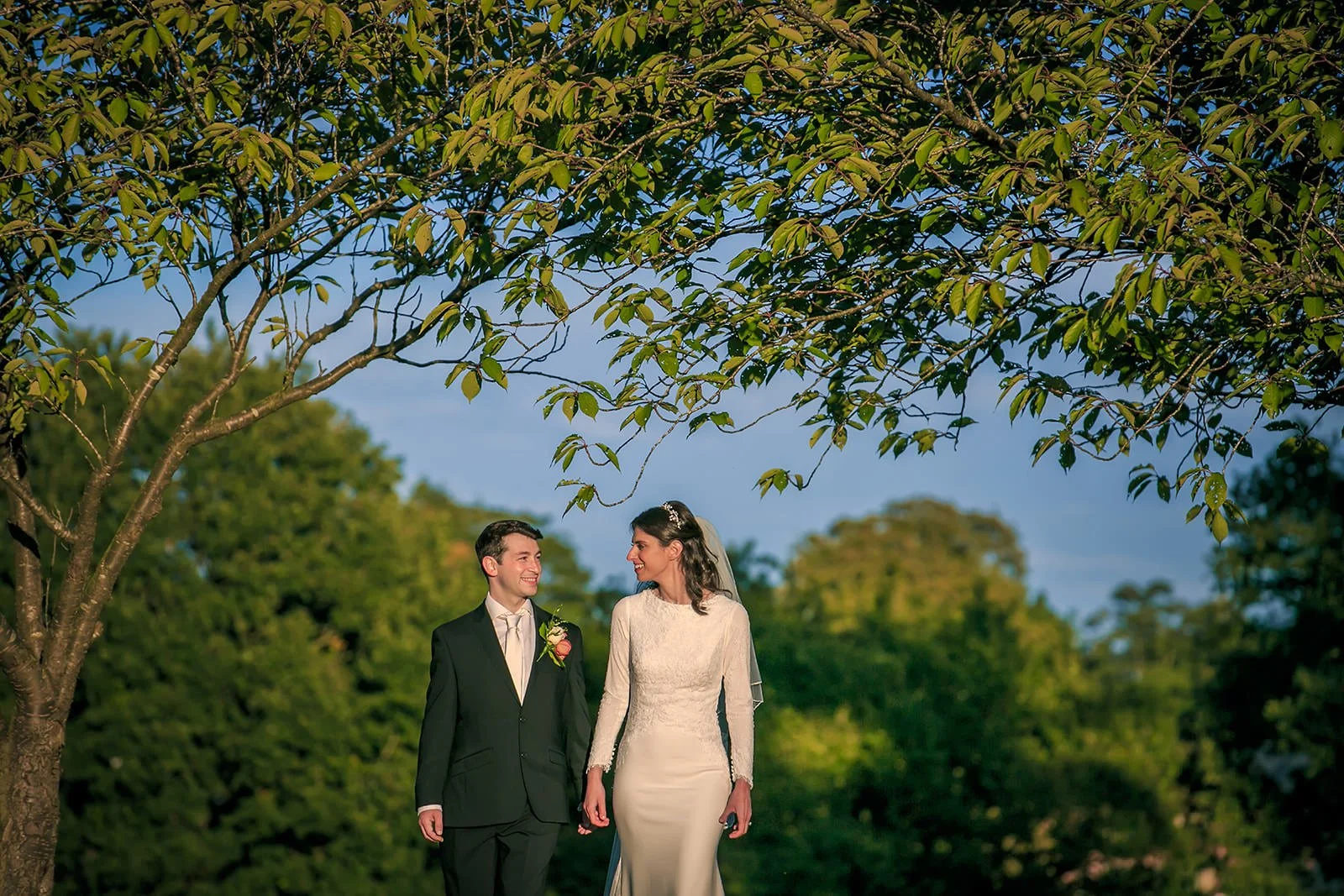 bride groom newlywed couple walking portrait during wedding at mere golf resort in cheshire