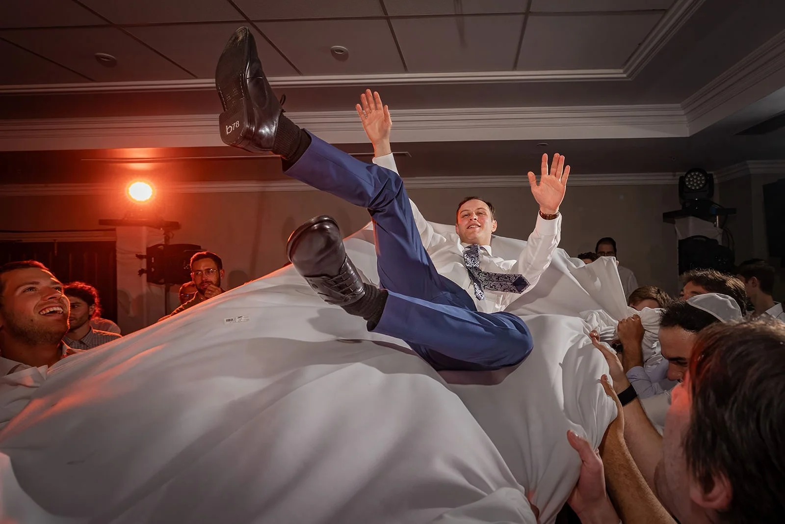 groom thrown in air by guests during reception party at worsley marriott hotel