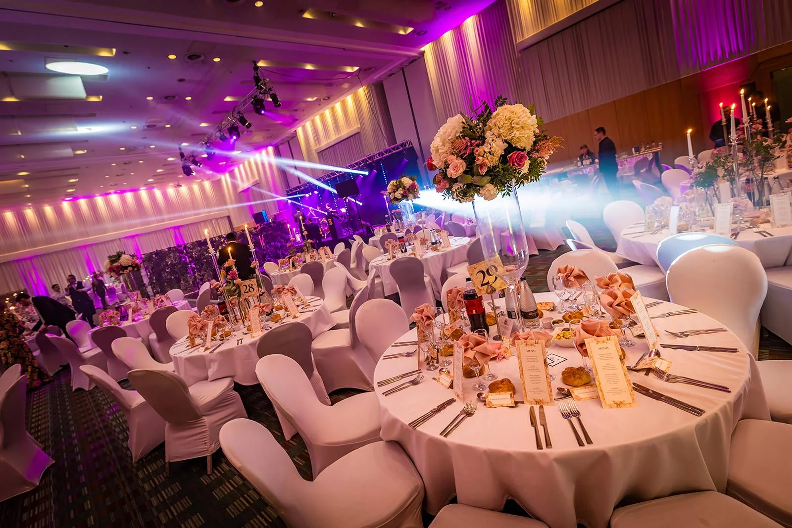 manchester deansgate hotel wedding reception room set up for dinner and dancing with decor and lighting