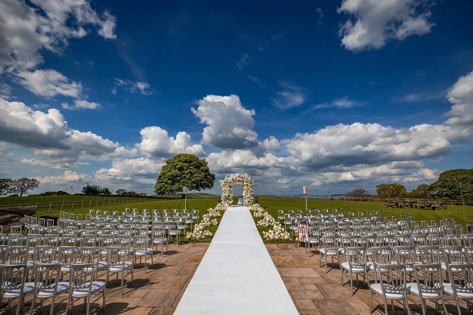 wedding ceremony outdoor floral set up at heaton house farm in macclesfield