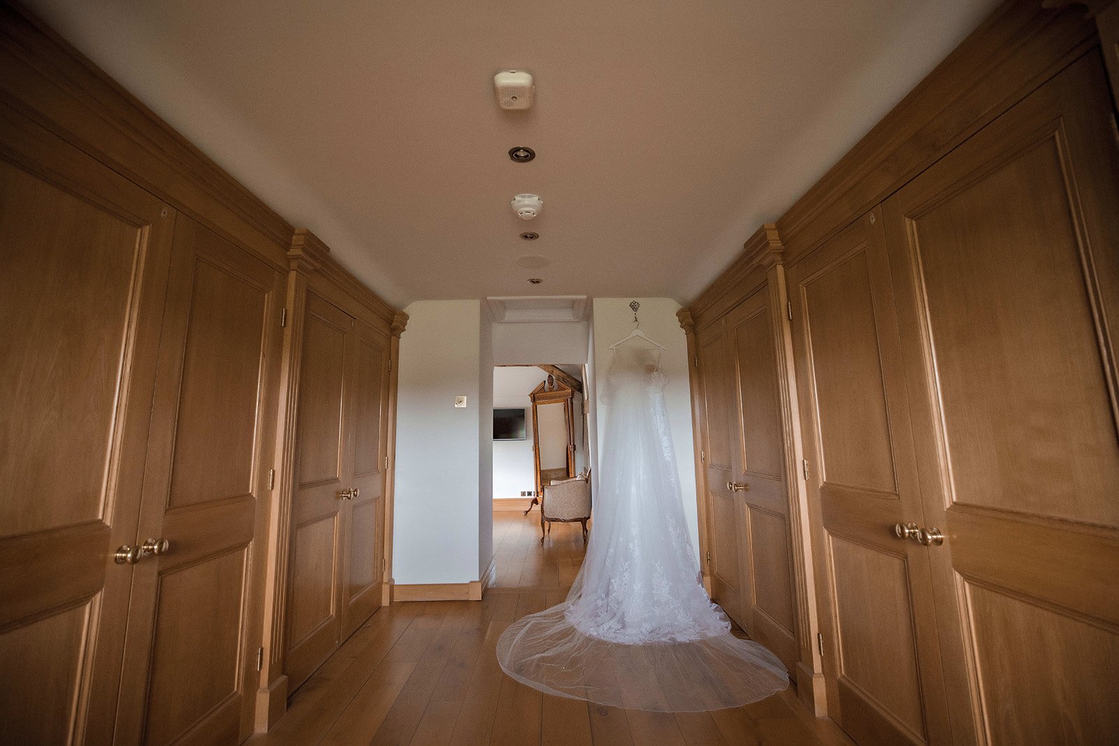 Merrydale Manor wedding dress hanging in hallway detail – wedding photography North West