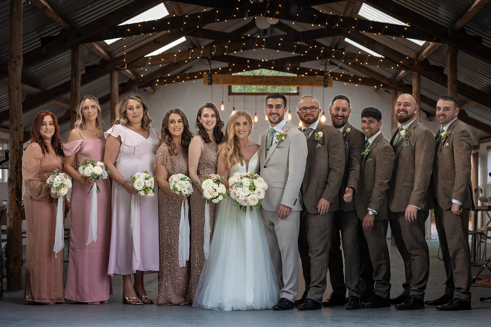 family portrait in piggery at white syke fields wedding venue