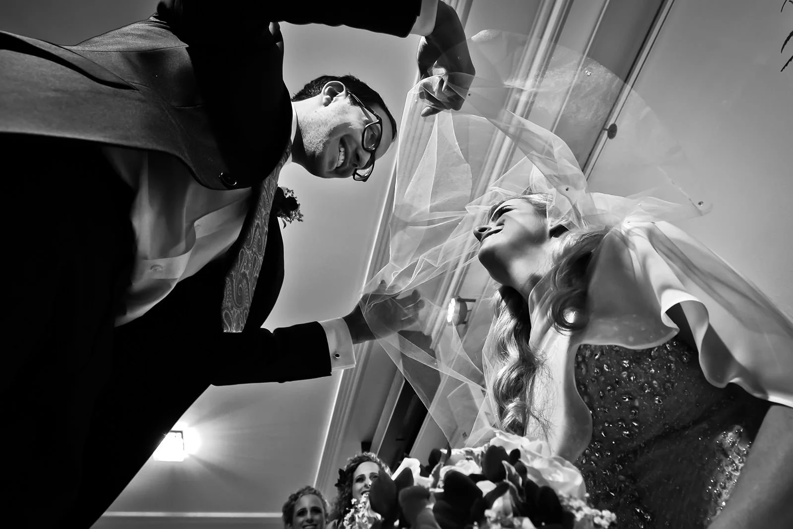 manchester wedding photographer photographs jewish groom and bride at bedeken smiling
